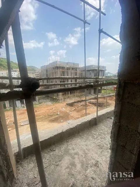 View through scaffolding from an upper floor over neighbouring building sites